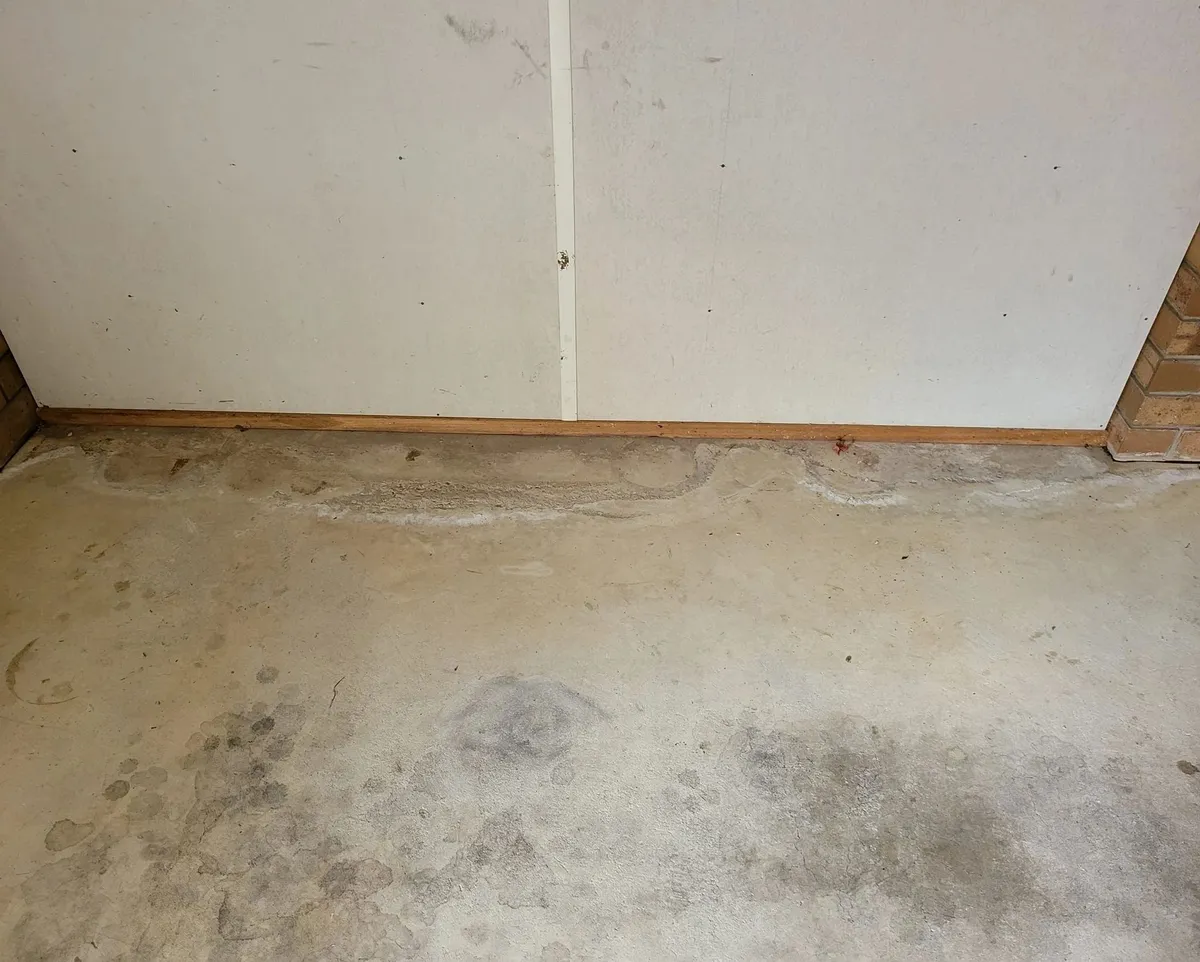 Ceiling and wall corner checked for moisture staining