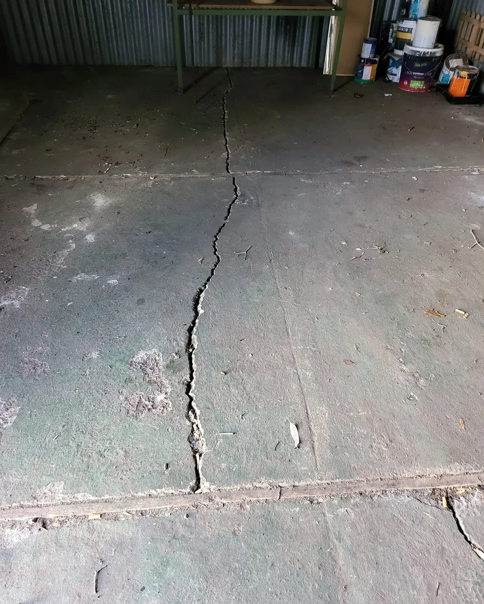 Cracked concrete paving noted during a property inspection