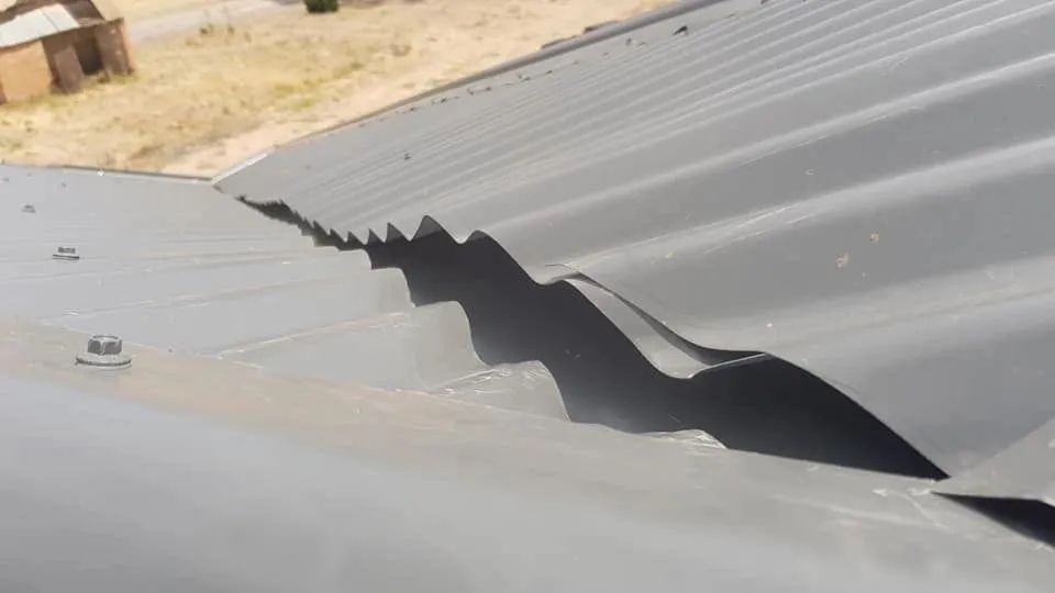 Damage to corrugated metal roofing found during inspection