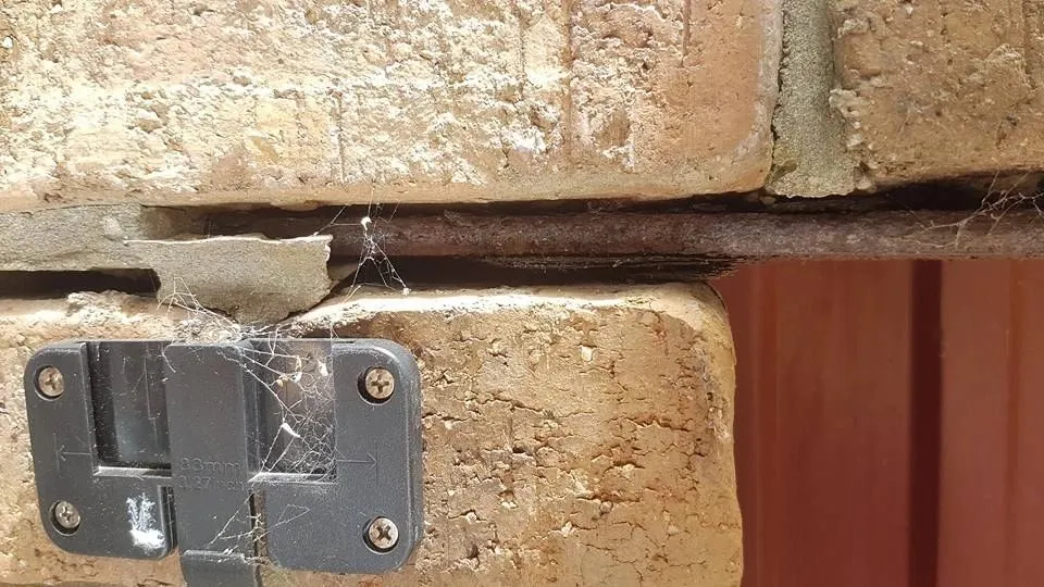 Structural bracket and timber connection inspected