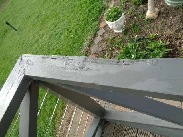 Dangerous timber decay in a balcony balustrade identified during inspection